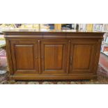 A French design cherry wood finished sideboard   with three moulded drawers over three panelled