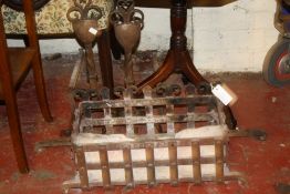 An iron firegrate and a pair of andirons
