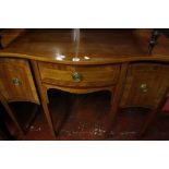 A Georgian style mahogany serpentine front sideboard  , the central frieze drawer flanked by deep