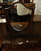 A 19th Century mahogany shield shape dressing table mirror  , the serpentine box base enclosing