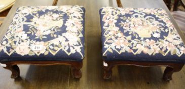 A pair of mahogany footstools   with needlework seats