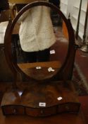 A George III mahogany serpentine dressing mirror   with three drawers