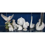 A quantity of Lladro   to include two doves, two swans and three polar bears; and another