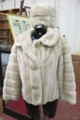 A vintage faux fur cream coat and matching hat   by Tissavel