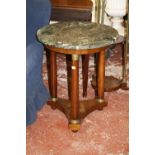 An Empire style mahogany and marble mounted circular table   on turned supports