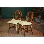 A pale green painted dining table (plus three leaves) and a set of four Windsor chairs, 20th