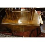 A Georgian style mahogany oval drop leaf table   on turned legs with pad feet 80cm wide