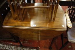 A Georgian style mahogany oval drop leaf table   on turned legs with pad feet 80cm wide
