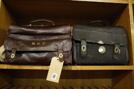 A brown leather Gladstone bag with initials M.E.C and another Gladstone bag (2)