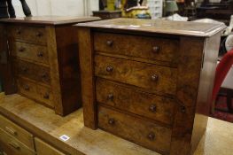 A pair of walnut table top chests   each with four drawers