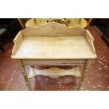 A Victorian pine galleried side table