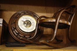 An oak aneroid barometer  , a miniature bentwood rocking chair, a tea caddy, a satinwood banded box