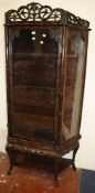 A Chinese hardwood display cabinet   enclosing shelves 188cm high, 100cm wide