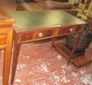A mahogany writing table   with a green leather top with two frieze drawers on square tapering legs