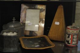 A miscellaneous collection of items   including a metronome, silverplate photo frame, wooden boxes,