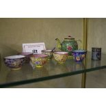 A Chinese miniature enamel teapot  , 8cm high (af), six assorted miniature tea bowls, and a