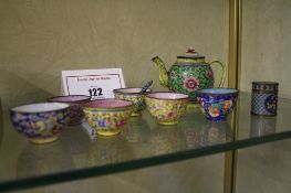 A Chinese miniature enamel teapot  , 8cm high (af), six assorted miniature tea bowls, and a