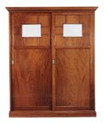 A late Victorian mahogany estate cupboard  , circa 1890, the moulded cornice above a pair of