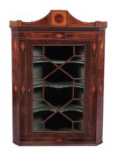 A George III mahogany and satinwood hanging corner cabinet  , circa 1790, line inlaid throughout,