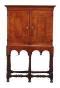 A walnut and parquetry cabinet on stand,   early 18th century and later  , the moulded cornice