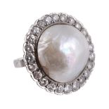 A mabe pearl and diamond ring,   circa 1920,    the mabe pearl within a surround of brilliant cut