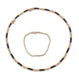 A black coral necklace,   the articulated necklace set with rectangular panels of black coral, with