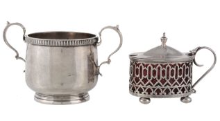 A silver circular twin handled sugar basin by The Goldsmiths  &  Silversmiths Co. Ltd,   London