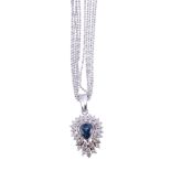 A sapphire and diamond pendant,   the pear shaped sapphire in a collet setting within a surround of