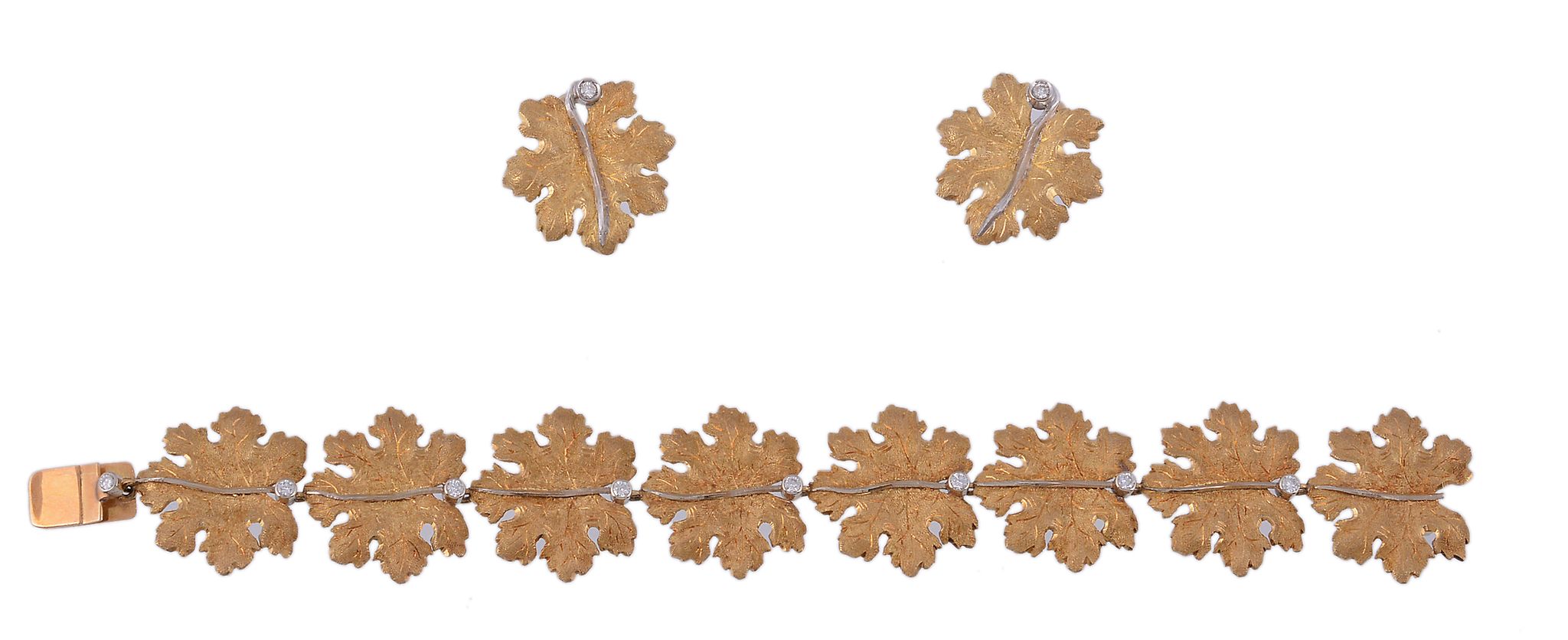 A leaf bracelet,   composed of textured leaf panels each set with a brilliant cut diamond, to a