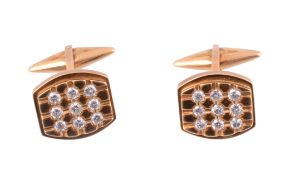 A pair of diamond set cufflinks  , the tonneau shaped panels each set with nine brilliant cut