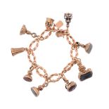 A fob seal charm bracelet,   circa 1880,  the bracelet composed of lovers knot shaped links,