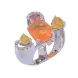 A multi gem set dress ring,   the oval shaped fire opal claw set with brilliant cut diamond