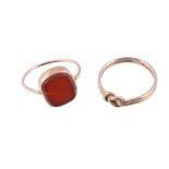 A cornelian ring,   the rectangular shaped cornelian panel in a collet setting, finger size K 1/2;