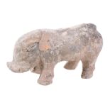 A Chinese pottery pig, in Han style, standing on four legs. 28cm long   A Chinese pottery pig,