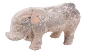 A Chinese pottery pig, in Han style, standing on four legs. 28cm long   A Chinese pottery pig,