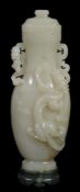 A celadon jade two handled vase and cover, of slender form   A celadon jade two handled vase and