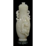 A celadon jade two handled vase and cover, of slender form   A celadon jade two handled vase and