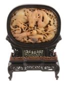A Chinese jade oval Ming-style confronting dragon table screen   A Chinese jade oval Ming-style