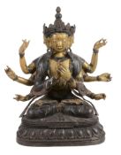 A Sino-Tibetan bronze seated multi-headed figure   A Sino-Tibetan bronze seated multi-headed figure,
