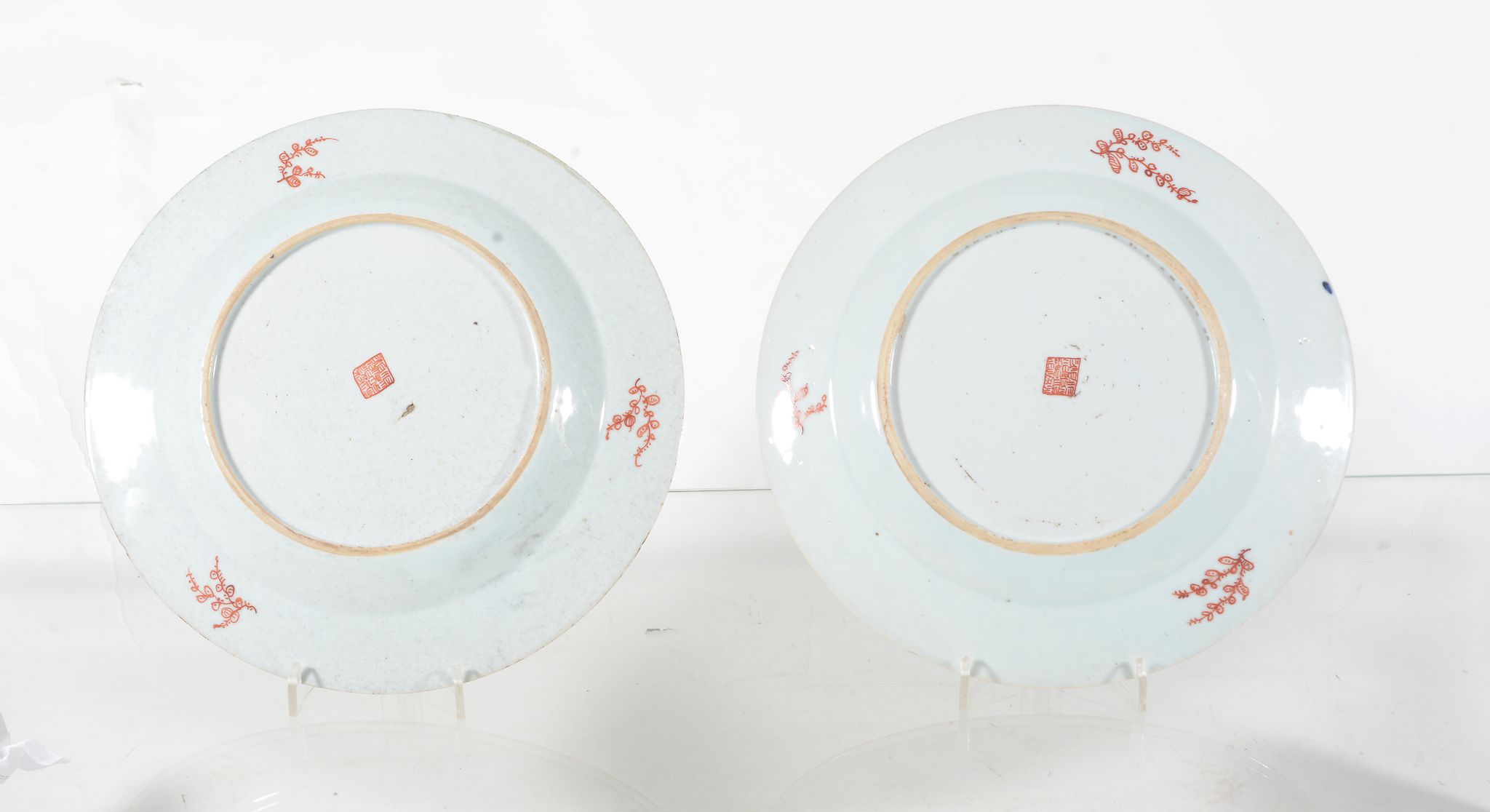 A pair of Chinese 'clobbered' plates, the porcelain Kangxi   A pair of Chinese 'clobbered' plates, - Image 2 of 2