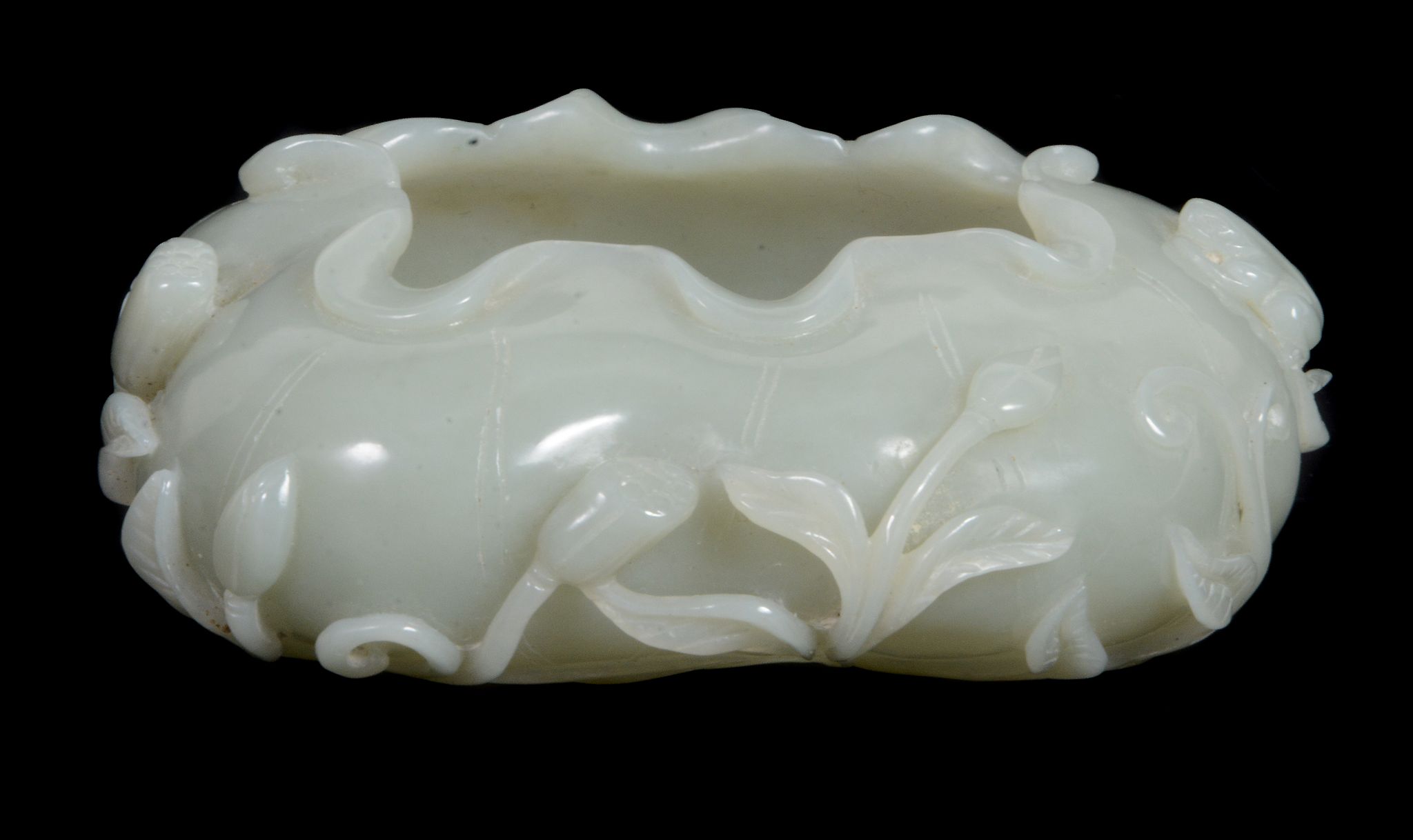 A Chinese celadon jade brush washer, of even colour with one area with...   A Chinese celadon jade