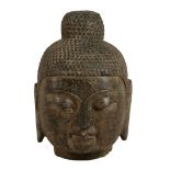A large Chinese grey stone head of a Buddha, Ming Dynasty or later   A large Chinese grey stone head