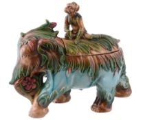 A Continental majolica tureen and cover modelled as an elephant and monkey...   A Continental