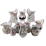 A selection of mostly British pottery relief-moulded jugs , various dates   A selection of mostly