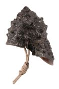 A Japanese Kawari Kabuto in the form of a large conch shell in black  A Japanese Kawari Kabuto in