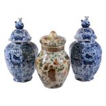 A pair of Dutch Delft blue and white octagonal vases and covers, circa 1900   A pair of Dutch