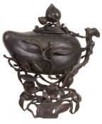 A large Chinese bronze 'peach' censor and cover   A large Chinese bronze 'peach' censor and cover,