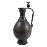 A Persian-type bronze ewer, of baluster form   A Persian-type bronze ewer,   of baluster form,