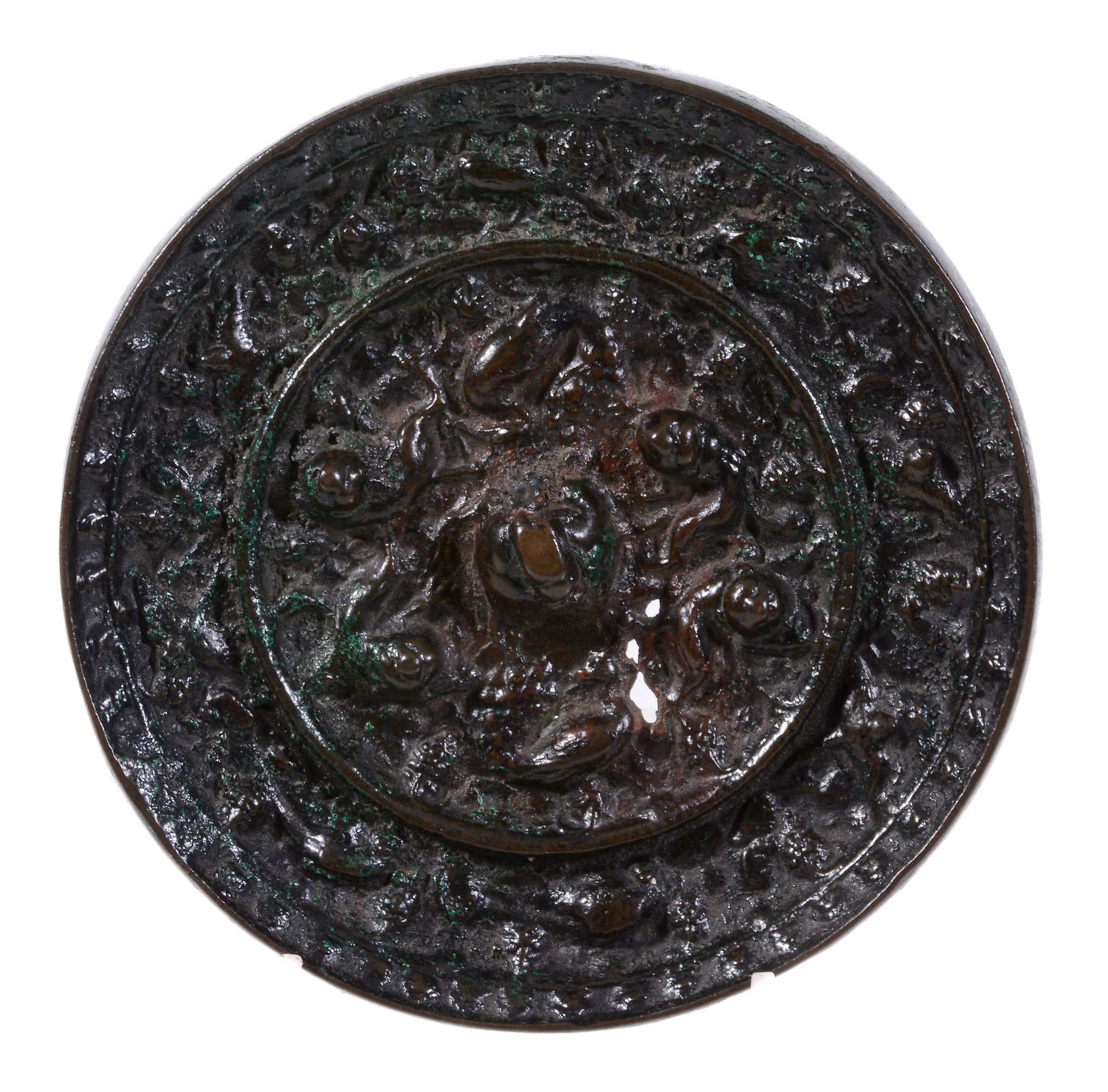 A Chinese bronze mirror , Tang Dynasty or later, 13.3cm diam.   A Chinese bronze mirror  , Tang