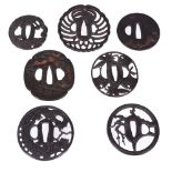 A Group of Seven Iron Tsuba, sukashi, some machi-bori, all overcleaned   A Group of Seven Iron